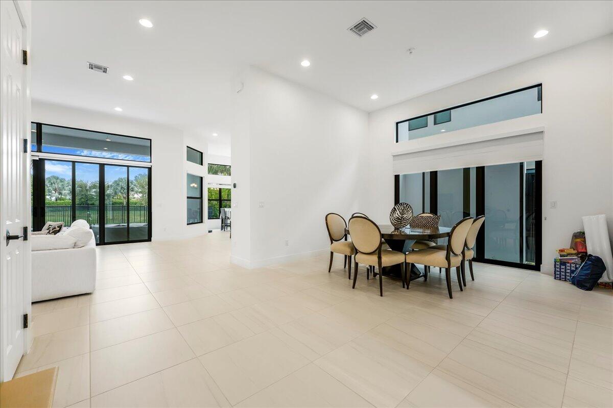 9093 Chauvet Way Boca Raton, FL 33496 - Photo 9 of 31 a view of a livingroom with furniture and floor to ceiling window