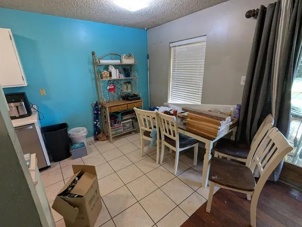a work room with furniture and wooden floor