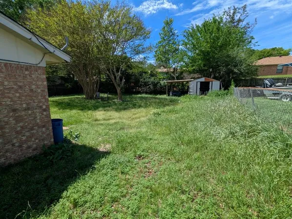 a view of a backyard with a garden