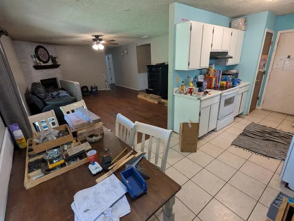 a kitchen with stainless steel appliances a refrigerator and a stove top oven