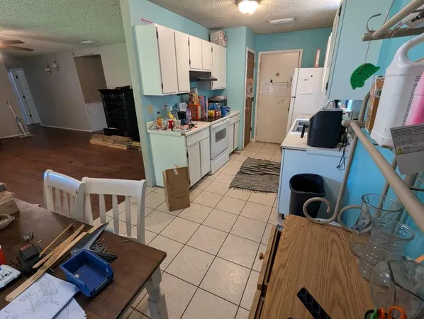 a view of living room with furniture and a window