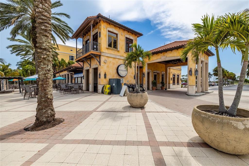 140 Riviera Dunes Way, Unit 404 Palmetto, FL 34221 - Photo 25 of 31 a view of a building with a patio
