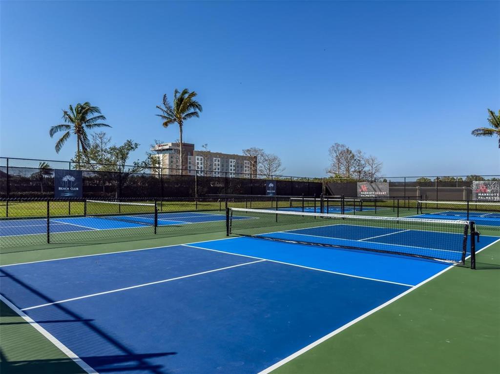 140 Riviera Dunes Way, Unit 404 Palmetto, FL 34221 - Photo 31 of 31 a view of tennis court
