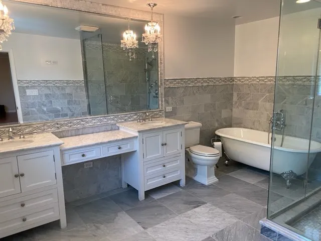 a bathroom with a sink a toilet and bathtub