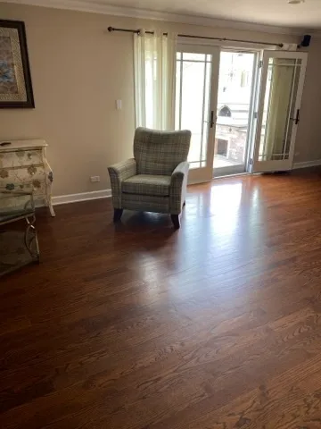 a living room with furniture and large windows