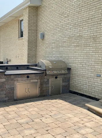 a view of the house with a yard