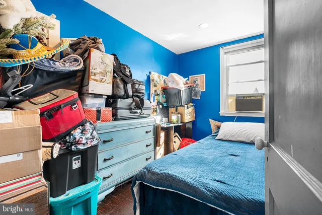 a bed room with a bed and a tv