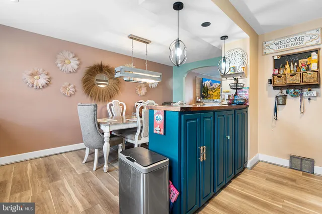 a kitchen with stainless steel appliances granite countertop a stove and cabinets