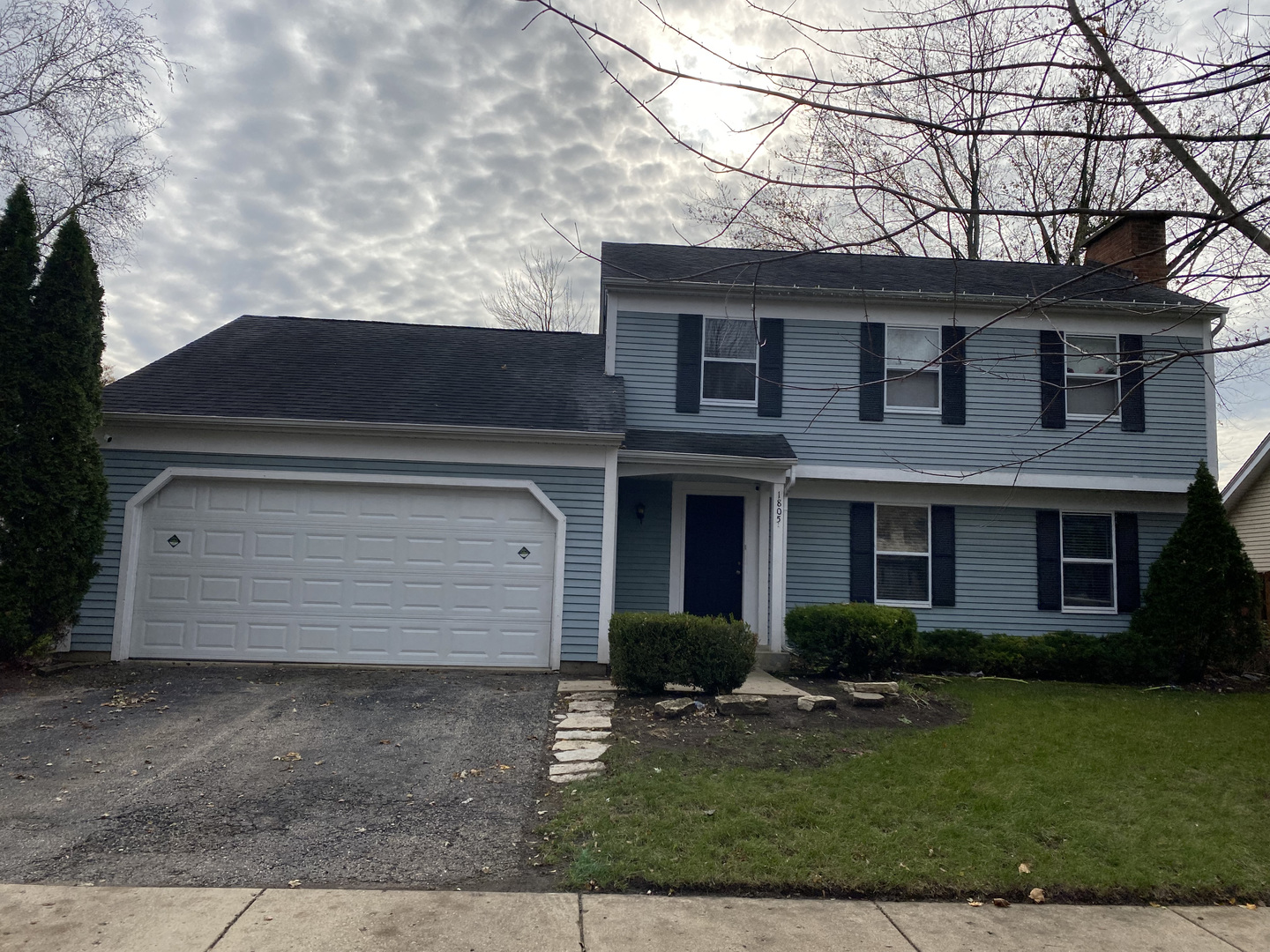 1805 Rita Avenue St. Charles, IL 60174 - Photo 1 of 17 a front view of a house with garden