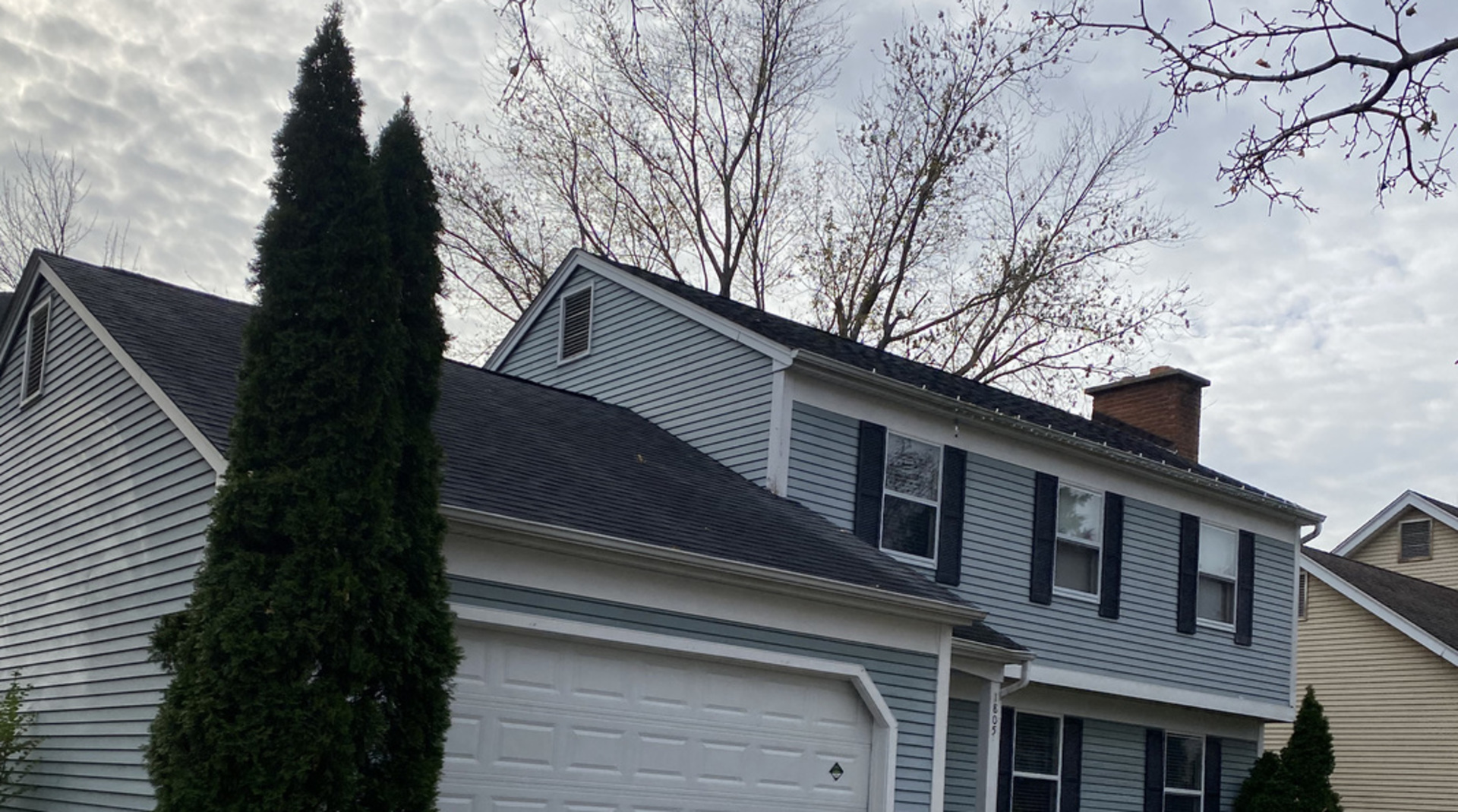 1805 Rita Avenue St. Charles, IL 60174 - Photo 2 of 17 a front view of a house with a trees