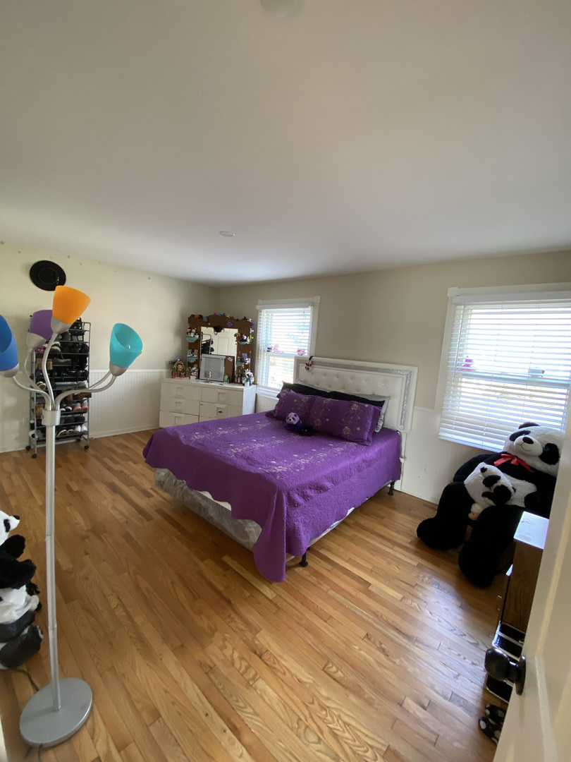1805 Rita Avenue St. Charles, IL 60174 - Photo 13 of 17 a bedroom with a bed and wooden floor