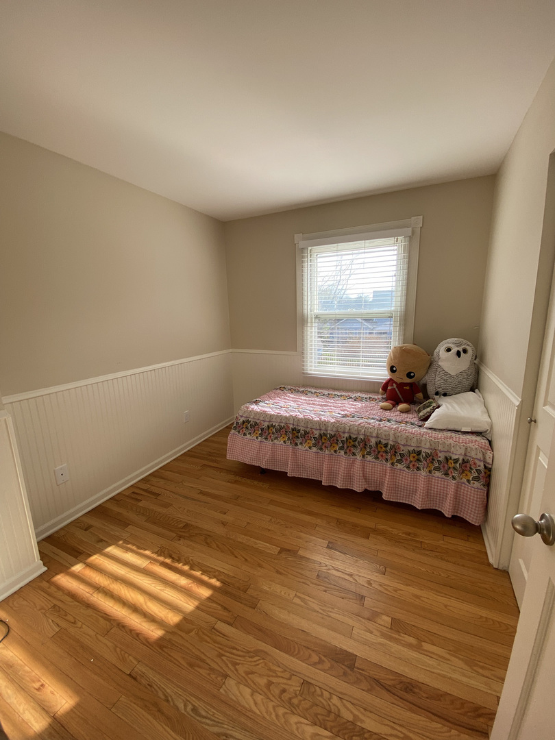 1805 Rita Avenue St. Charles, IL 60174 - Photo 14 of 17 a bedroom with a bed and window