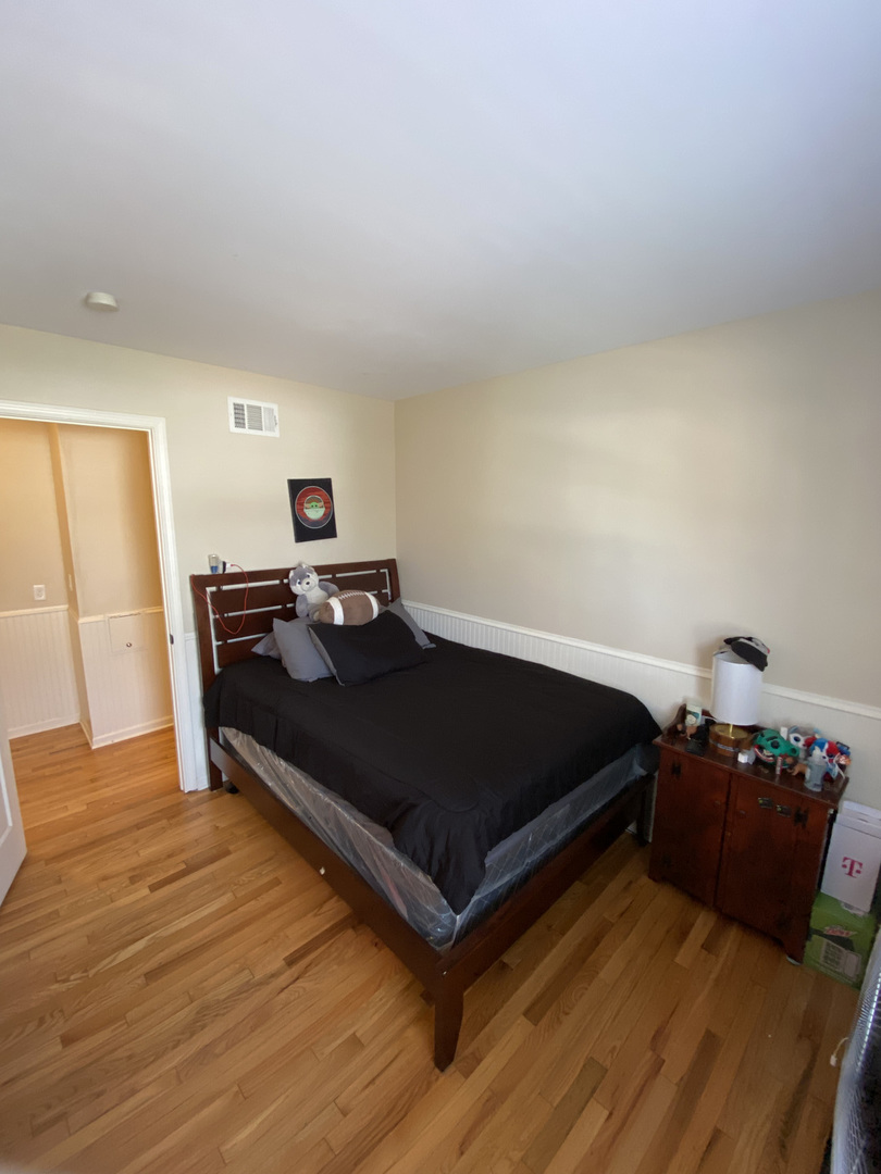 1805 Rita Avenue St. Charles, IL 60174 - Photo 15 of 17 a bedroom with a bed and a table