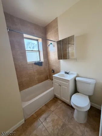 a bathroom with a toilet sink and bathtub