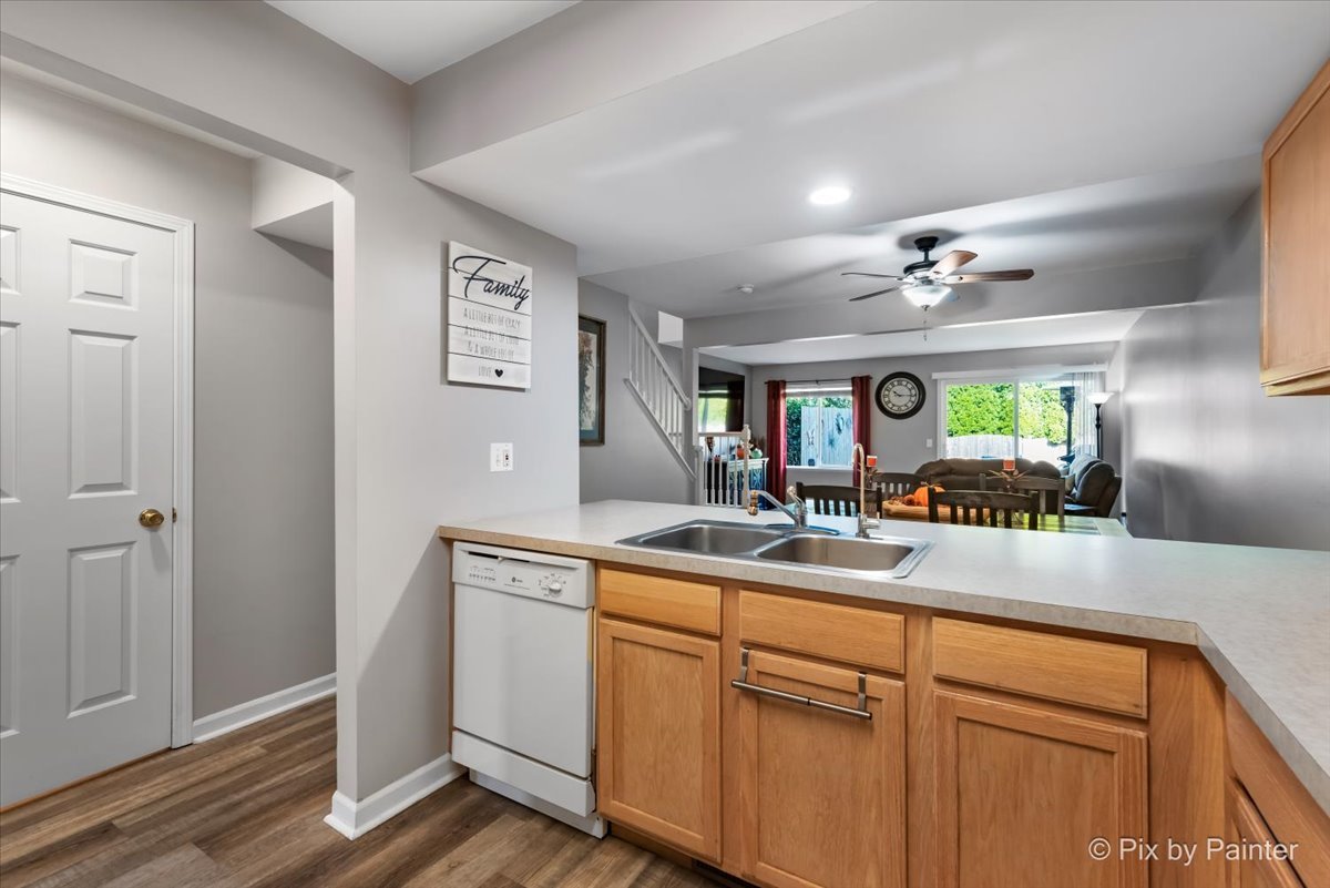 5742 Fieldstone Trail McHenry, IL 60050 - Photo 14 of 29 a view of living room with granite countertop furniture and flat screen tv