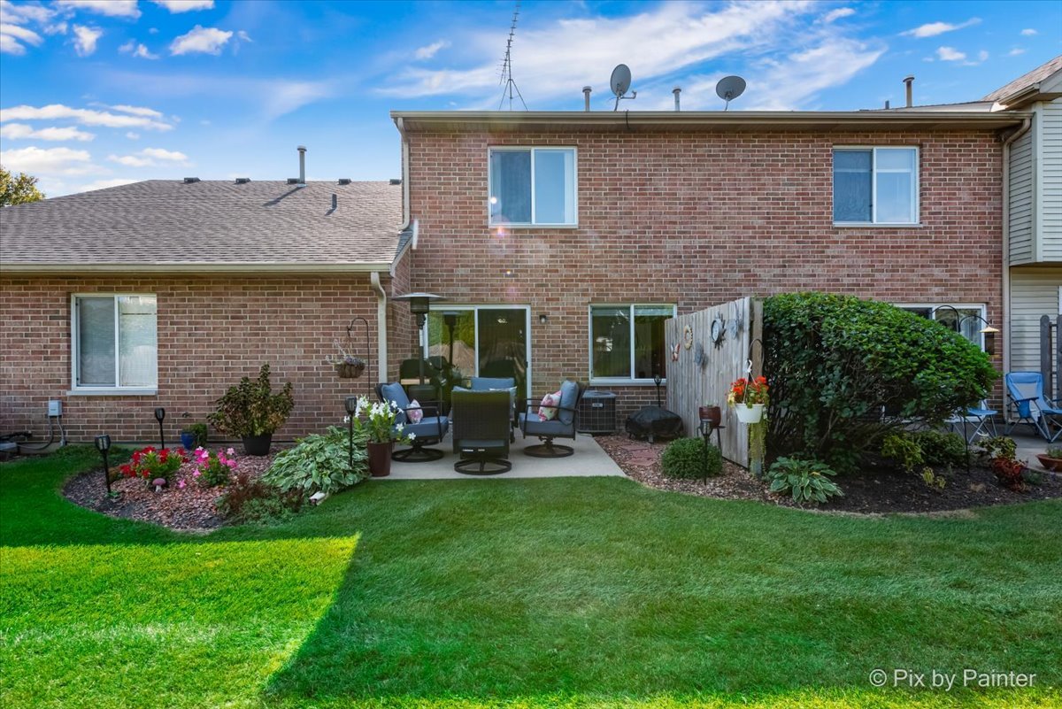5742 Fieldstone Trail McHenry, IL 60050 - Photo 25 of 29 a view of a house with backyard sitting area and garden