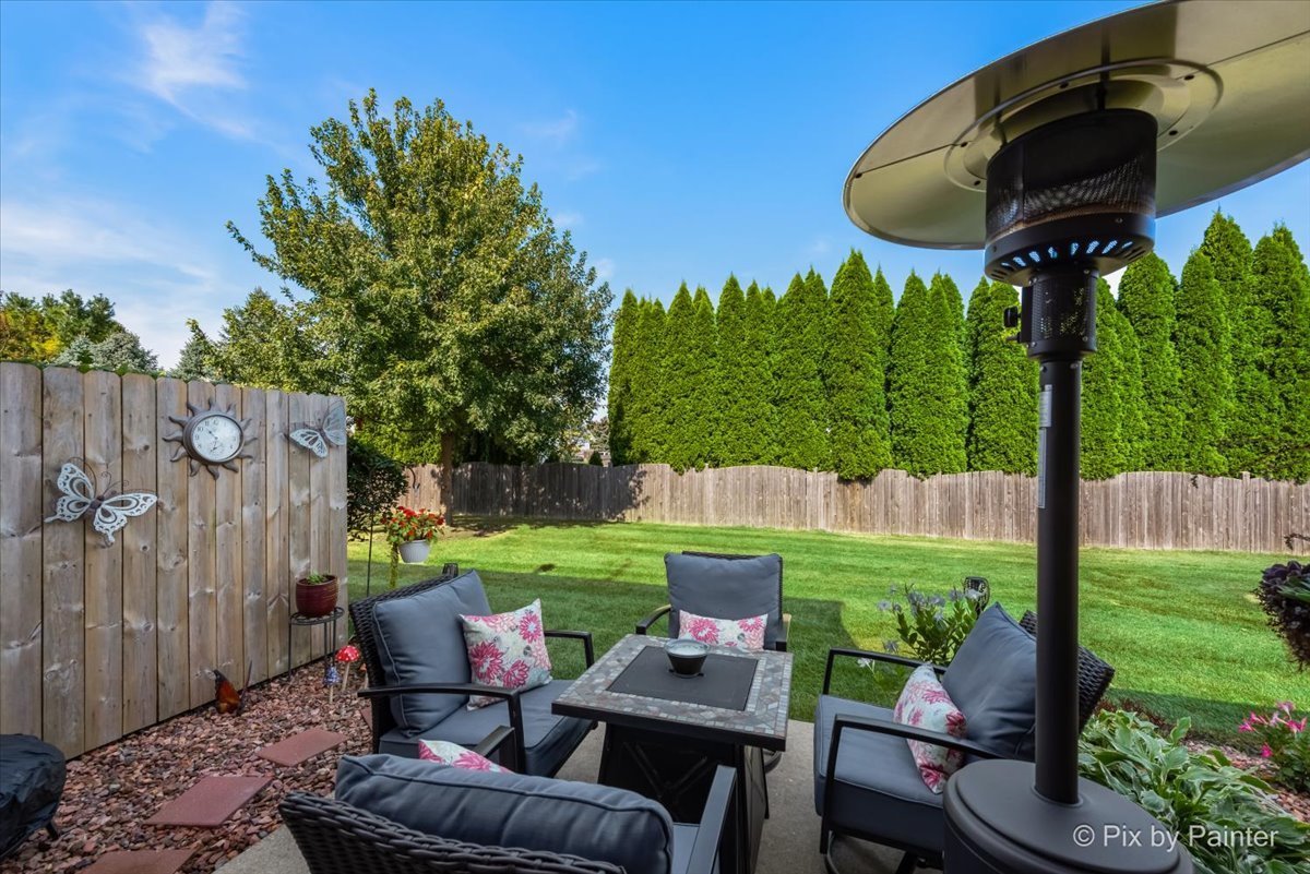 5742 Fieldstone Trail McHenry, IL 60050 - Photo 4 of 29 a backyard of a house with outdoor seating