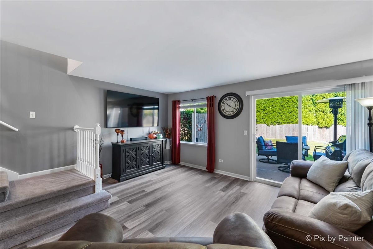 5742 Fieldstone Trail McHenry, IL 60050 - Photo 7 of 29 a living room with furniture and a large window