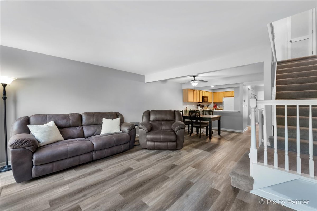 5742 Fieldstone Trail McHenry, IL 60050 - Photo 8 of 29 a living room with furniture and a table