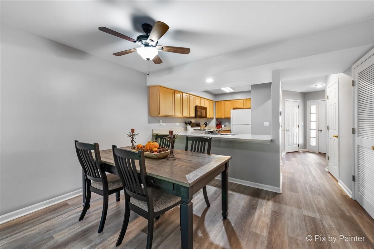5742 Fieldstone Trail McHenry, IL 60050 - Photo 10 of 29 a view of a dining room with furniture and a kitchen