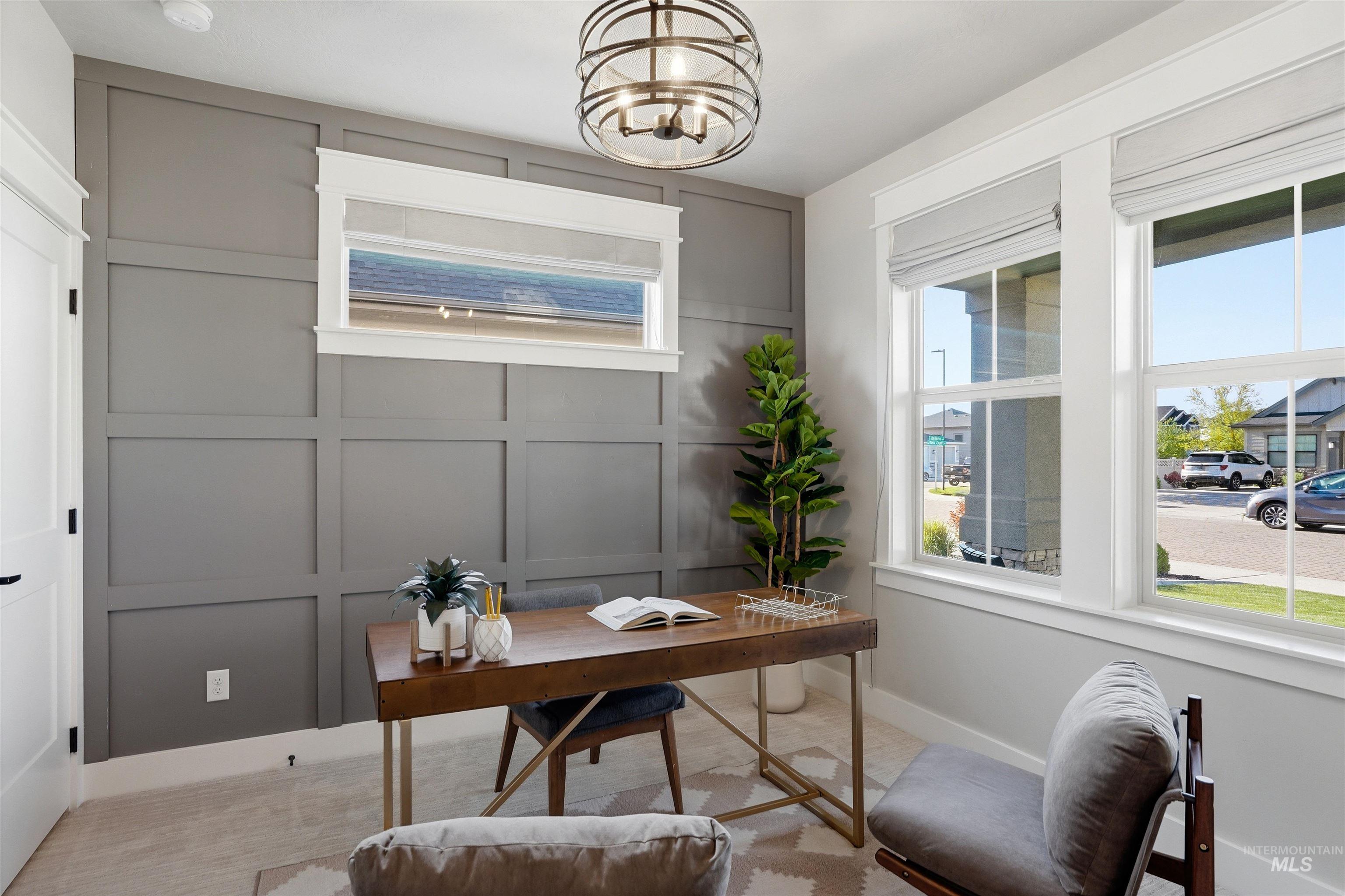 3915 West Riva Capri Street Meridian, ID 83646 - Photo 16 of 49 Office space featuring board and batten accent wall, natural light from multiple windows, and a contemporary spherical chandelier