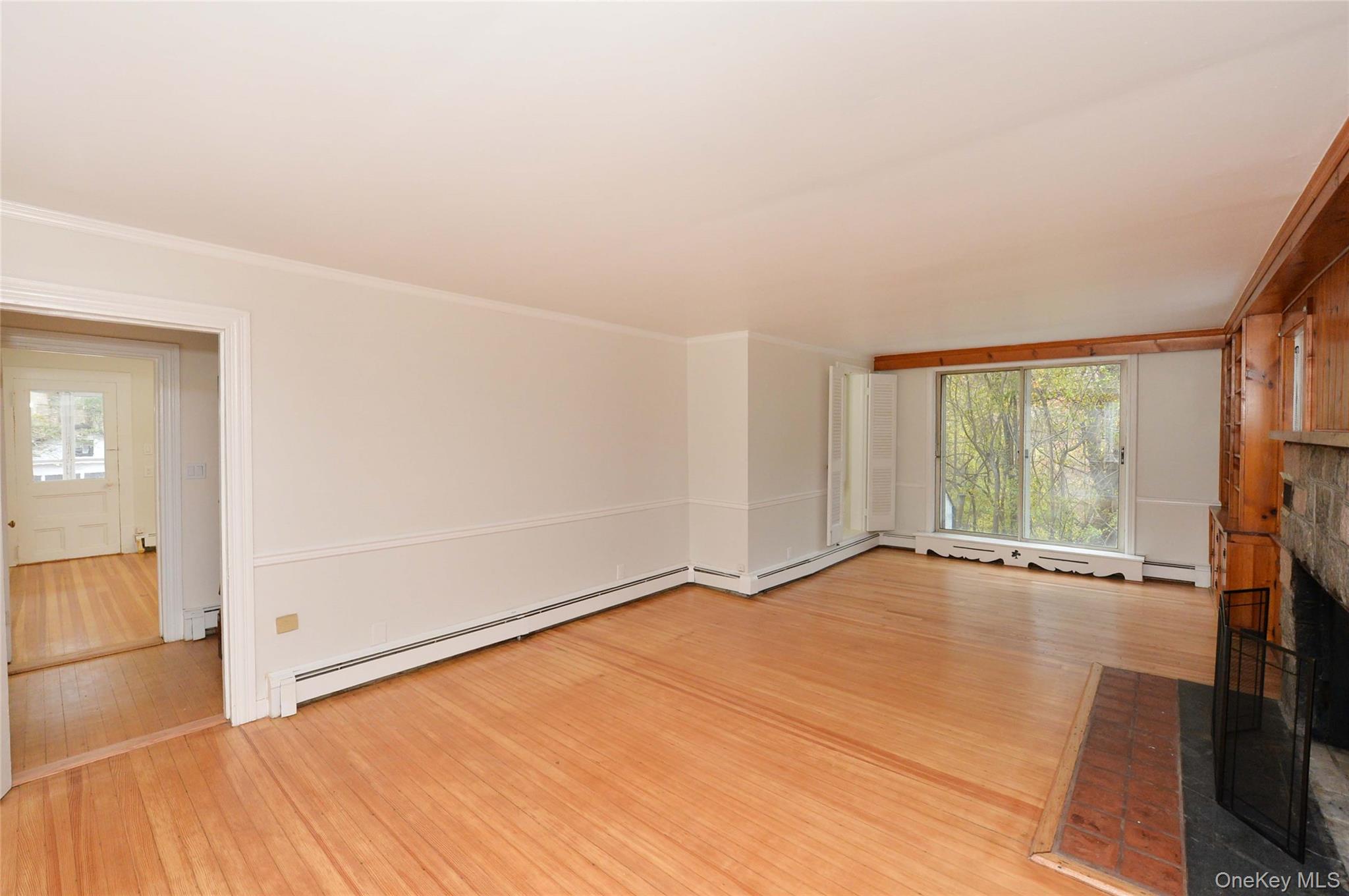 19 Johnsontown Road Sloatsburg, NY 10974 - Photo 17 of 41 an empty room with wooden floor and windows