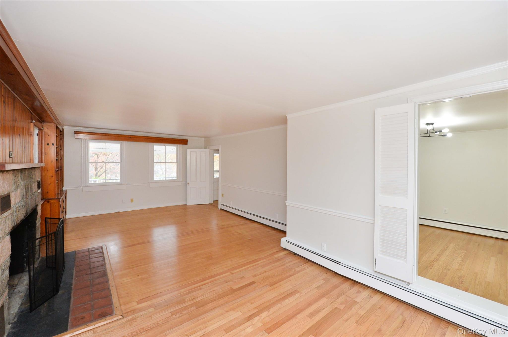 19 Johnsontown Road Sloatsburg, NY 10974 - Photo 21 of 41 an empty room with wooden floor and windows