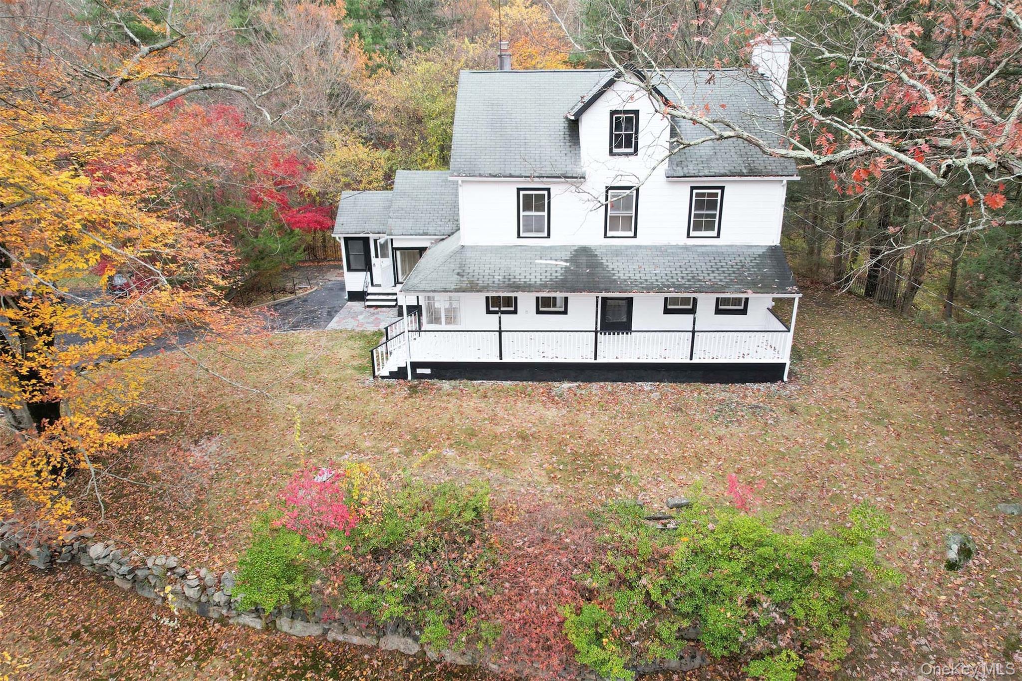 19 Johnsontown Road Sloatsburg, NY 10974 - Photo 22 of 41 a front view of a house with a yard and fountain
