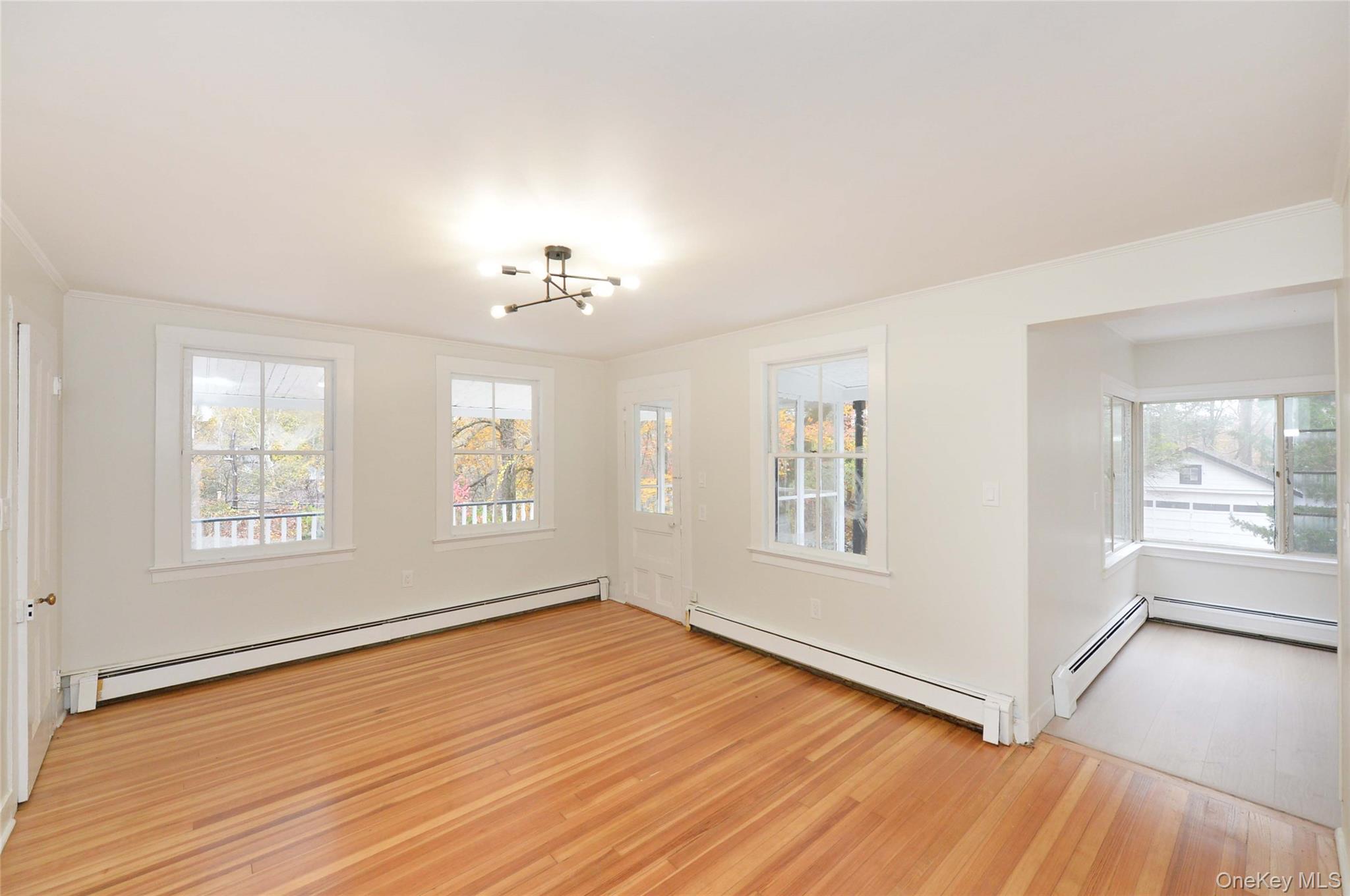 19 Johnsontown Road Sloatsburg, NY 10974 - Photo 3 of 41 an empty room with wooden floor and windows