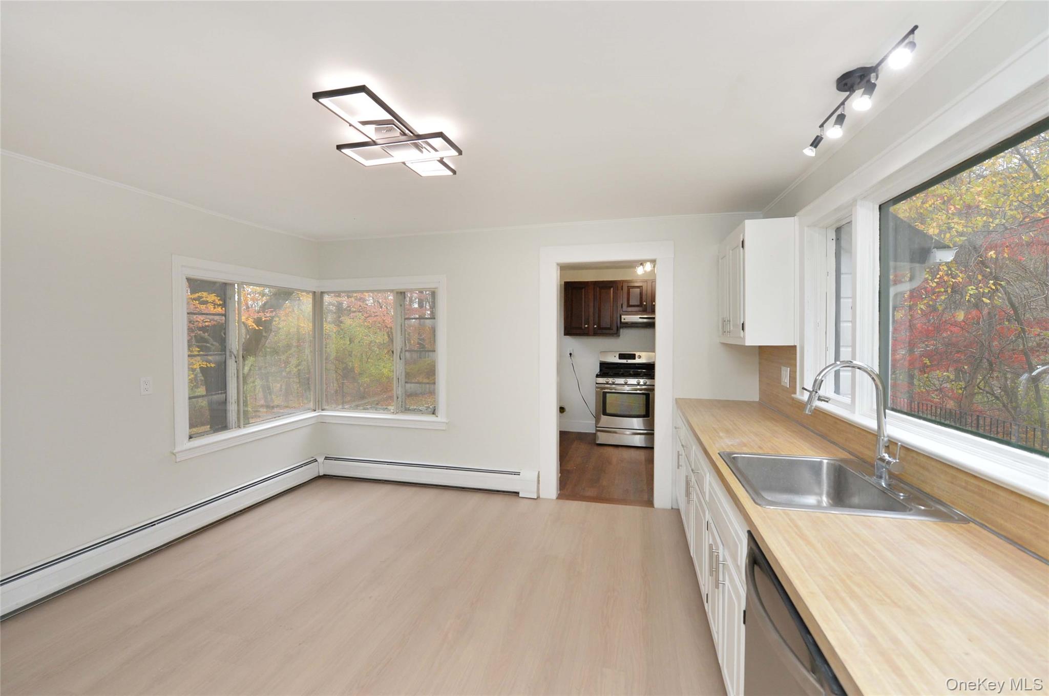 19 Johnsontown Road Sloatsburg, NY 10974 - Photo 10 of 41 a large kitchen with granite countertop a large window and a sink
