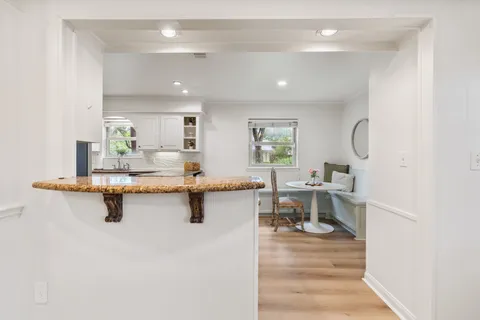 a kitchen with sink cabinets and window
