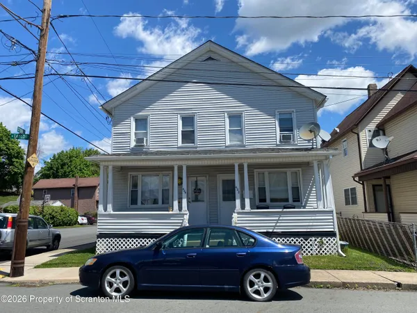a car parked in front of a house