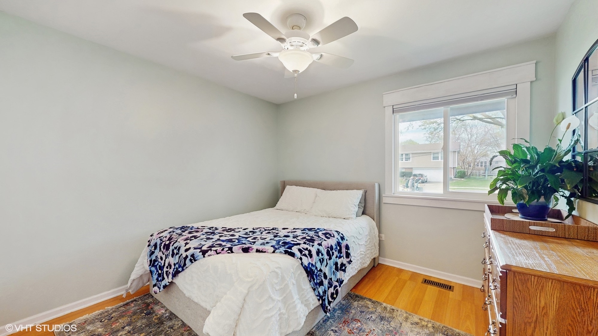 2206 Oak Lane Rolling Meadows, IL 60008 - Photo 13 of 24 a bedroom with a bed and a potted plant