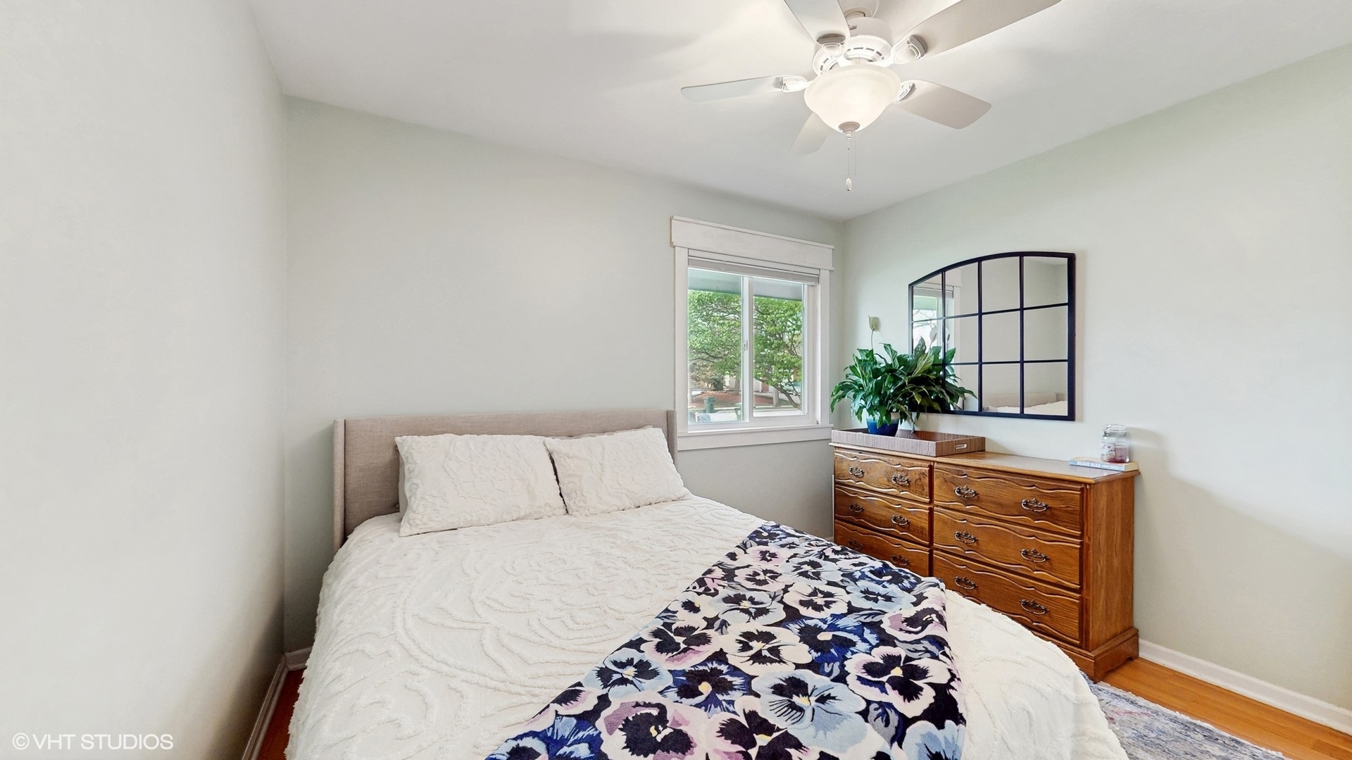 2206 Oak Lane Rolling Meadows, IL 60008 - Photo 14 of 24 a bedroom with a bed and a chandelier