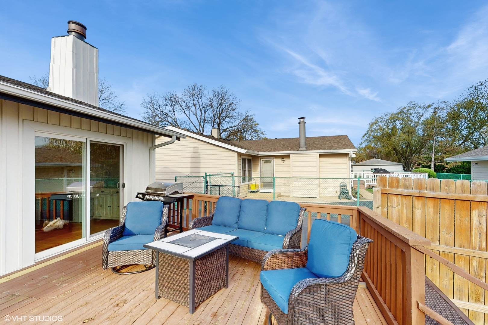 2206 Oak Lane Rolling Meadows, IL 60008 - Photo 20 of 24 a view of a deck with couches table and chairs with wooden floor and fence