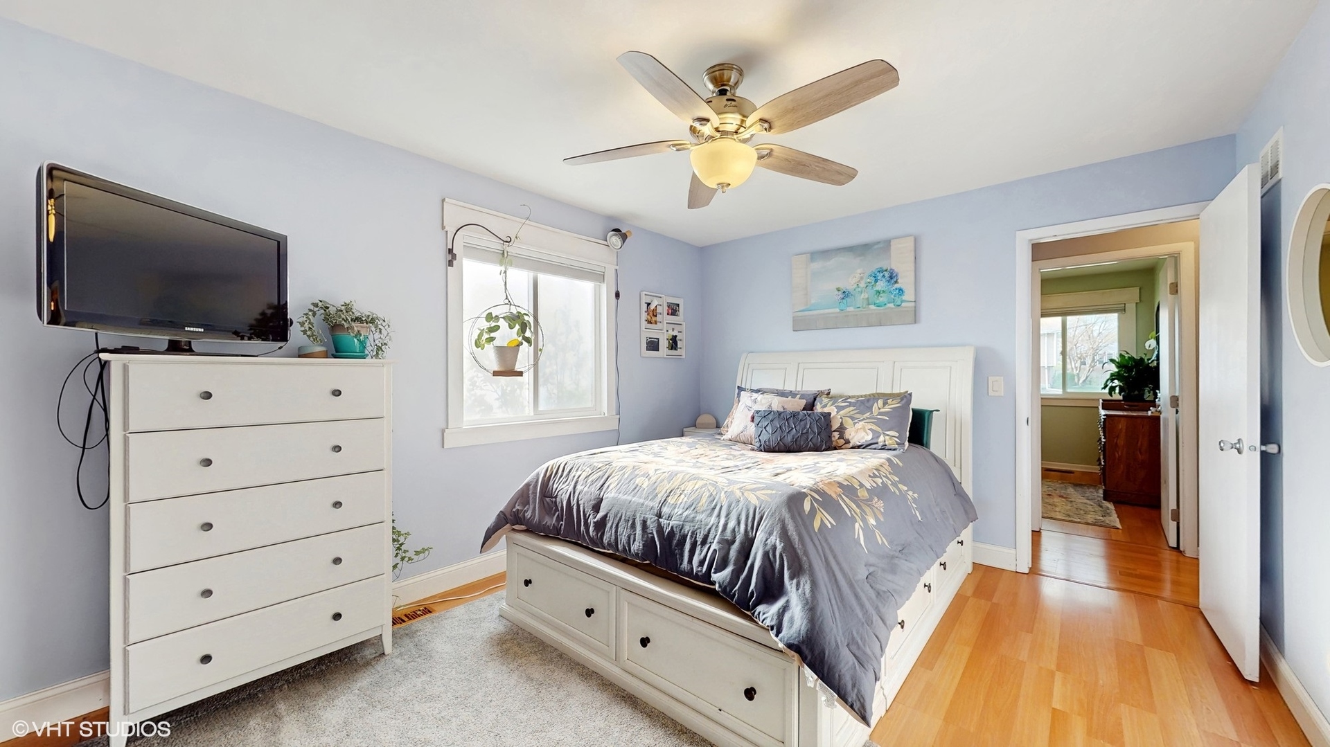 2206 Oak Lane Rolling Meadows, IL 60008 - Photo 10 of 24 a bedroom with a bed and a flat screen tv