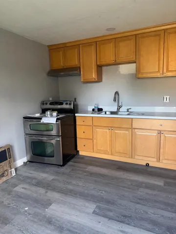 a view of front door with wooden floor