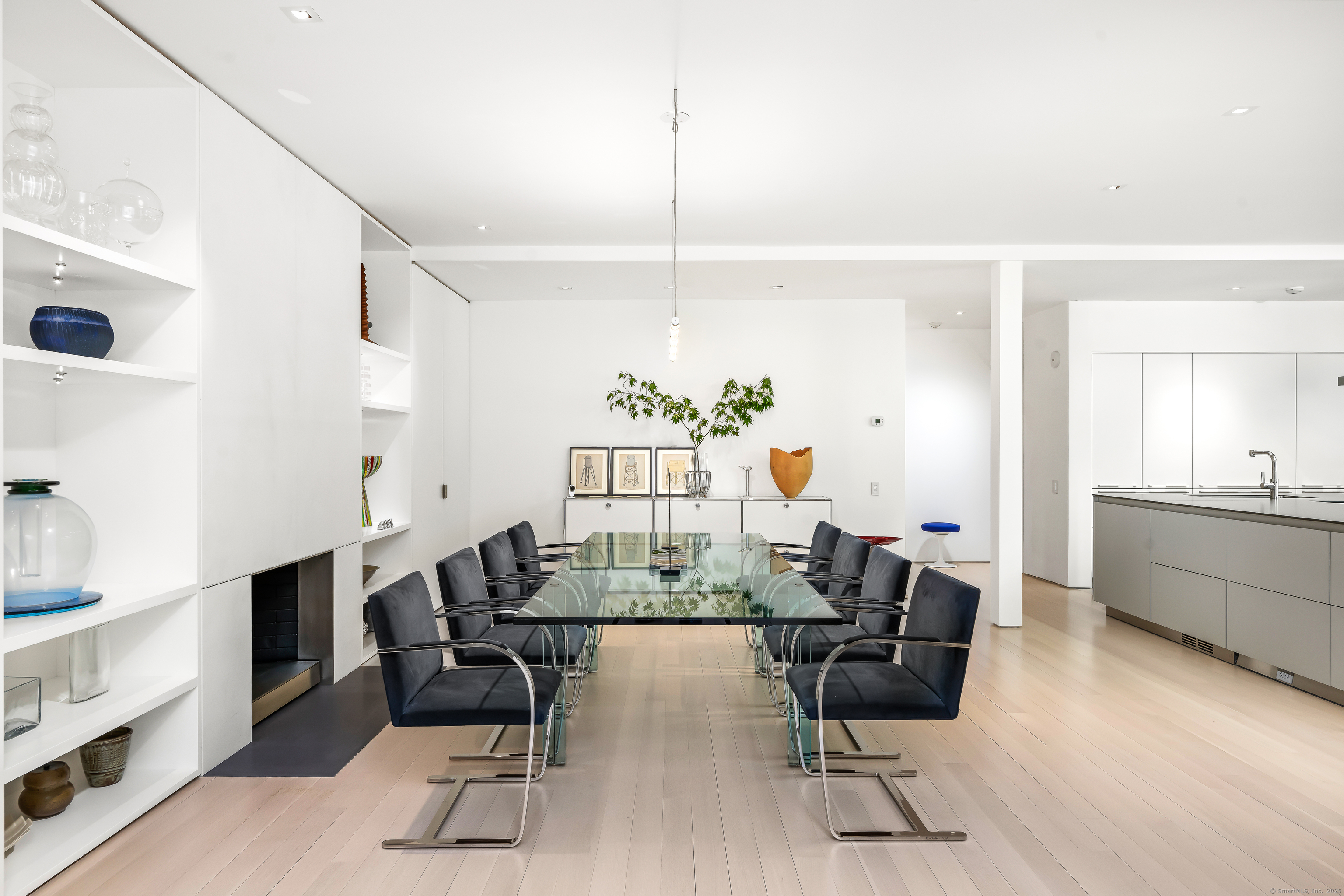 565 Oenoke Ridge New Canaan, CT 06840 - Photo 12 of 39 a view of a dining room with furniture and a chandelier