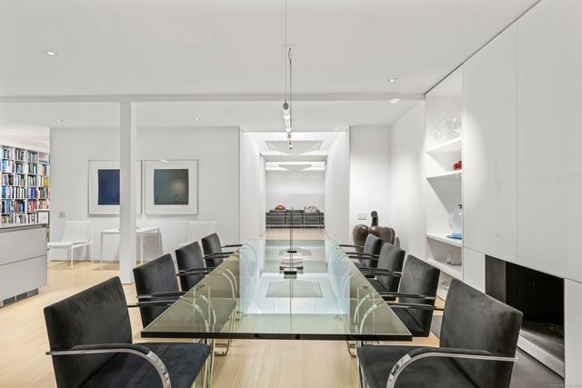a large white kitchen with white cabinets