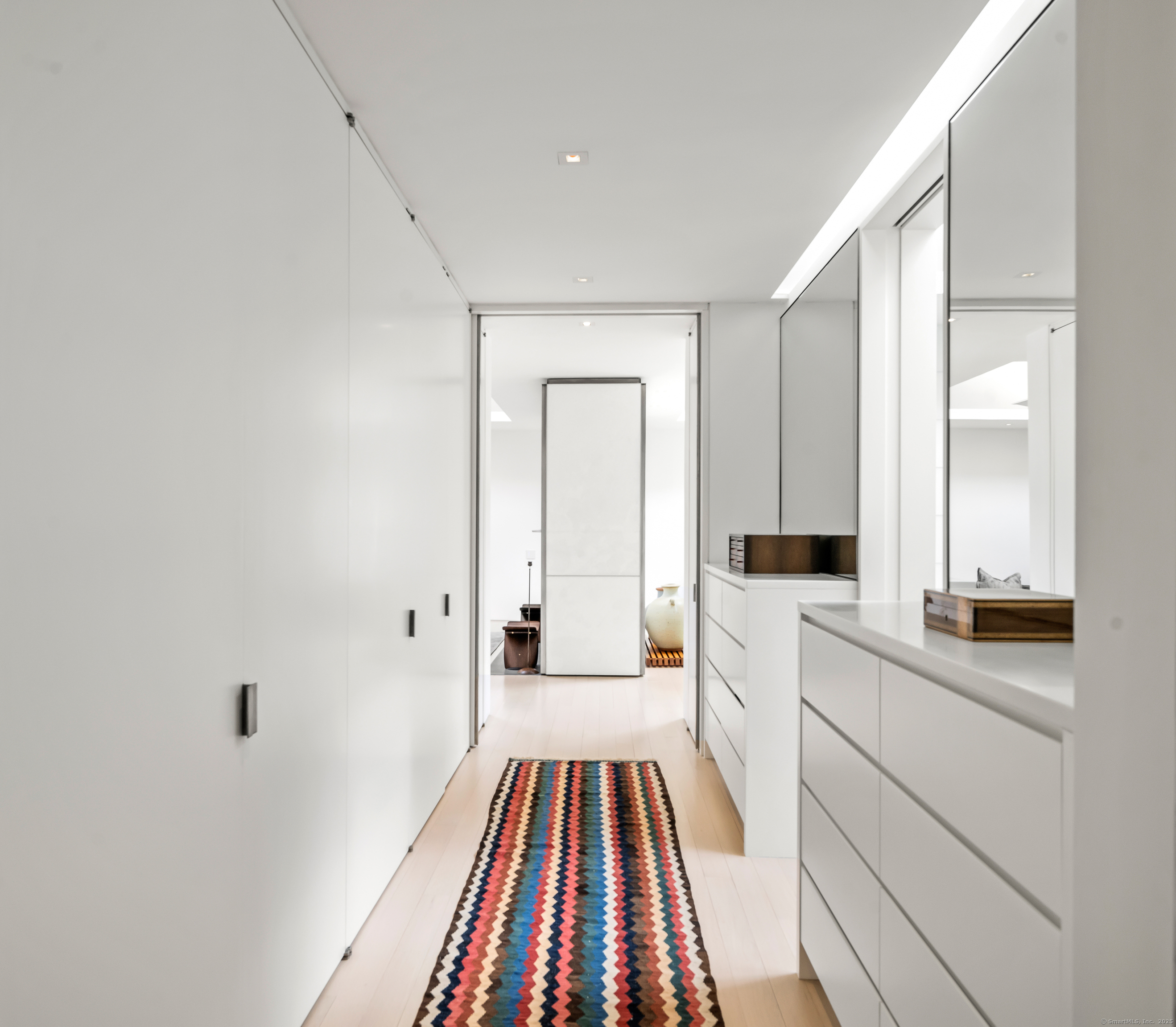 565 Oenoke Ridge New Canaan, CT 06840 - Photo 17 of 39 a large white kitchen with white cabinets