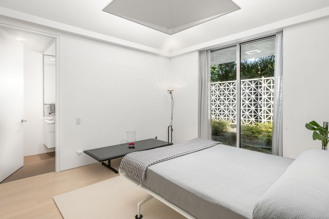 a bathroom with a sink toilet tub and shower