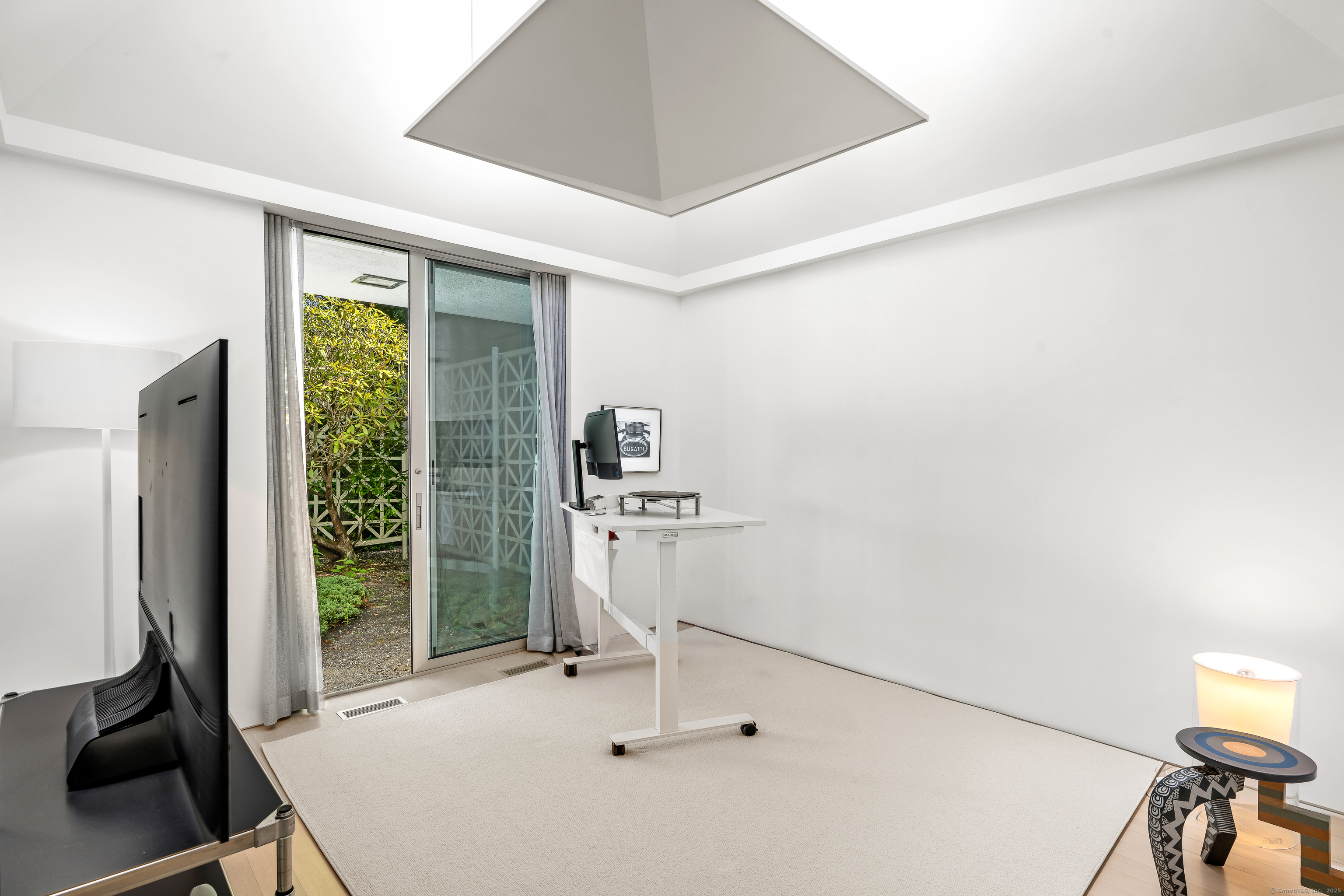 565 Oenoke Ridge New Canaan, CT 06840 - Photo 22 of 39 a room with a table and chairs