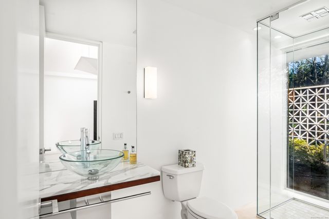 a bathroom with a sink and toilet