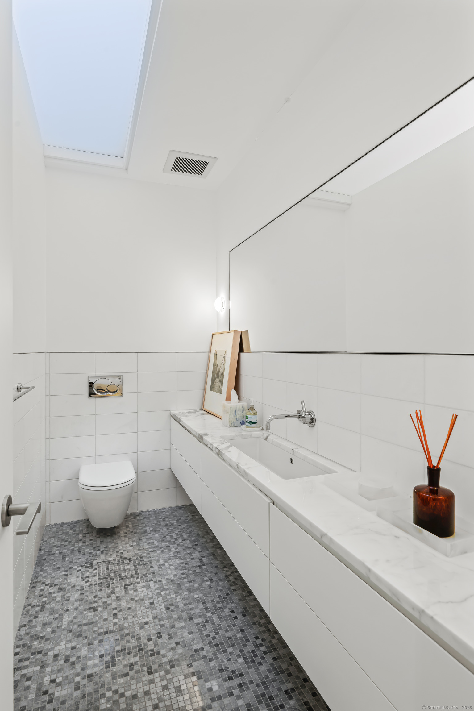 565 Oenoke Ridge New Canaan, CT 06840 - Photo 24 of 39 a bathroom with a sink and toilet