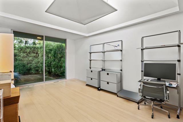 a living room with furniture and a ceiling fan