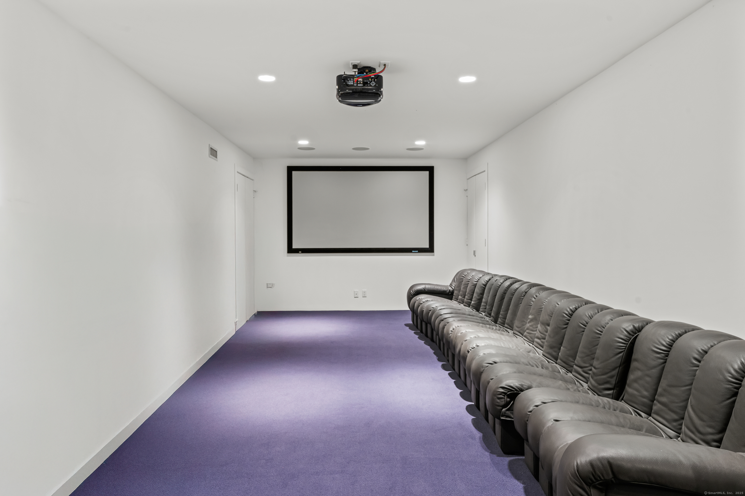 565 Oenoke Ridge New Canaan, CT 06840 - Photo 26 of 39 a living room with furniture and a ceiling fan