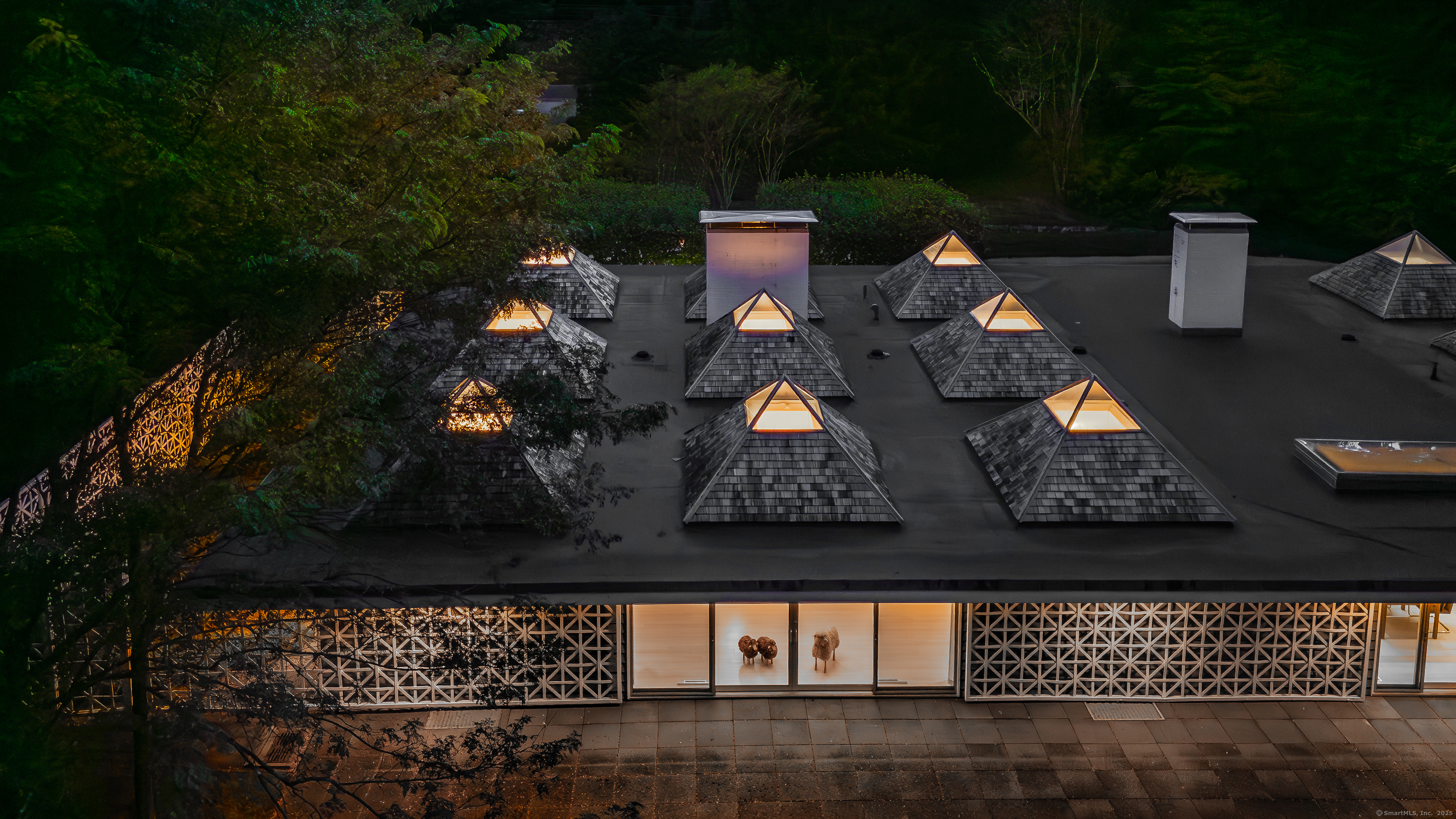 565 Oenoke Ridge New Canaan, CT 06840 - Photo 38 of 39 a living room with furniture and a fireplace