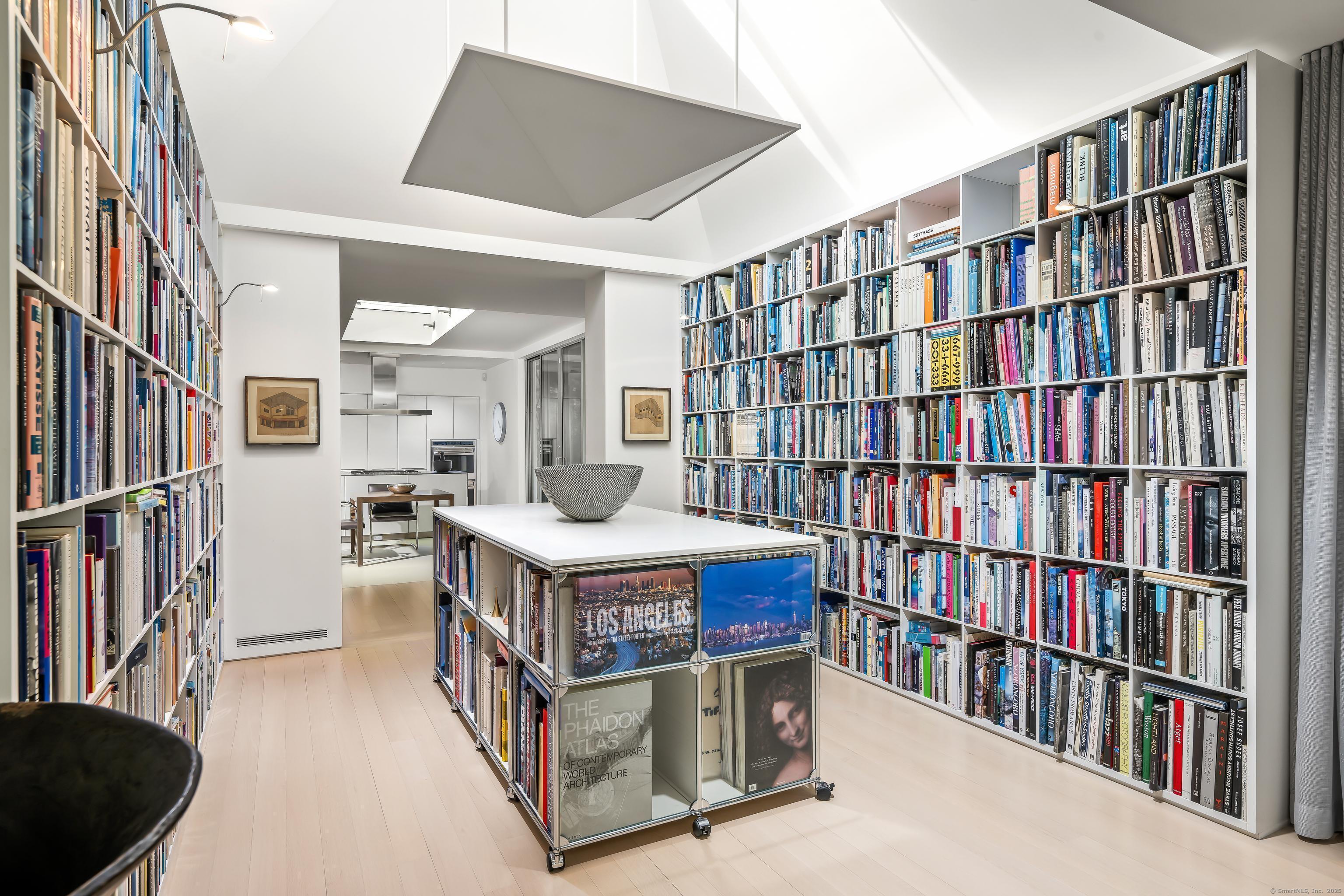 565 Oenoke Ridge New Canaan, CT 06840 - Photo 10 of 39 a living room with lots of books