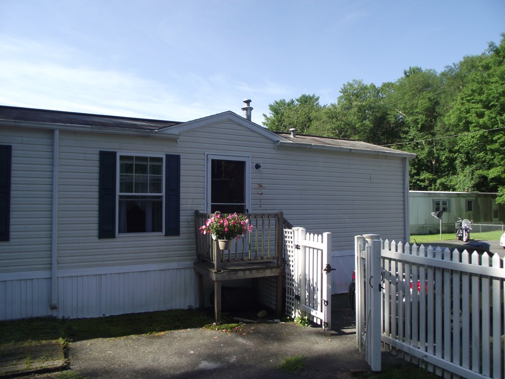 51 Monson Turnpike Road, Unit 1054 Ware, MA 01082 - Photo 22 of 23 a front view of a house