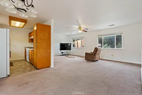 a view of a livingroom with furniture and windows